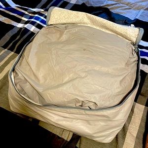 Car cover. Water resistant. Size is good for a Prius/ civic. Compact car size.